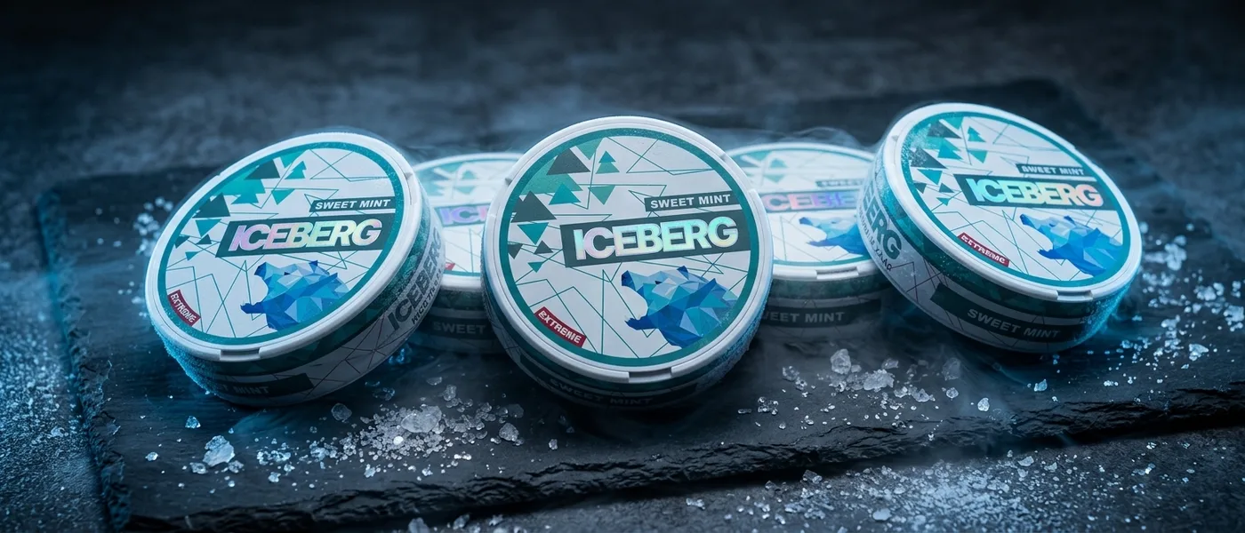 Several Iceberg nicotine pouch cans in a cold icy scene