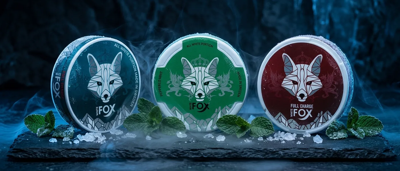White Fox nicotine pouch cans in cool icy lighting on a dark background